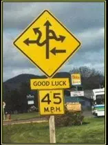 A sign with arrows in every direction: "Good luck", 45 mph