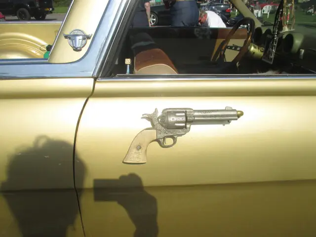 A gold car door with a handle shaped like a revolver