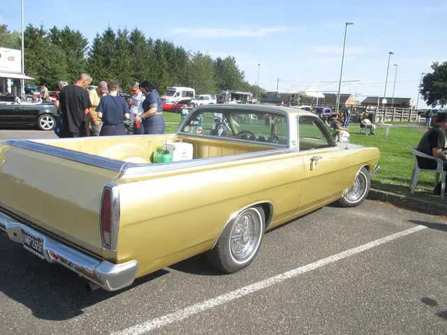 A gold American pick-up with whitewall tyres
